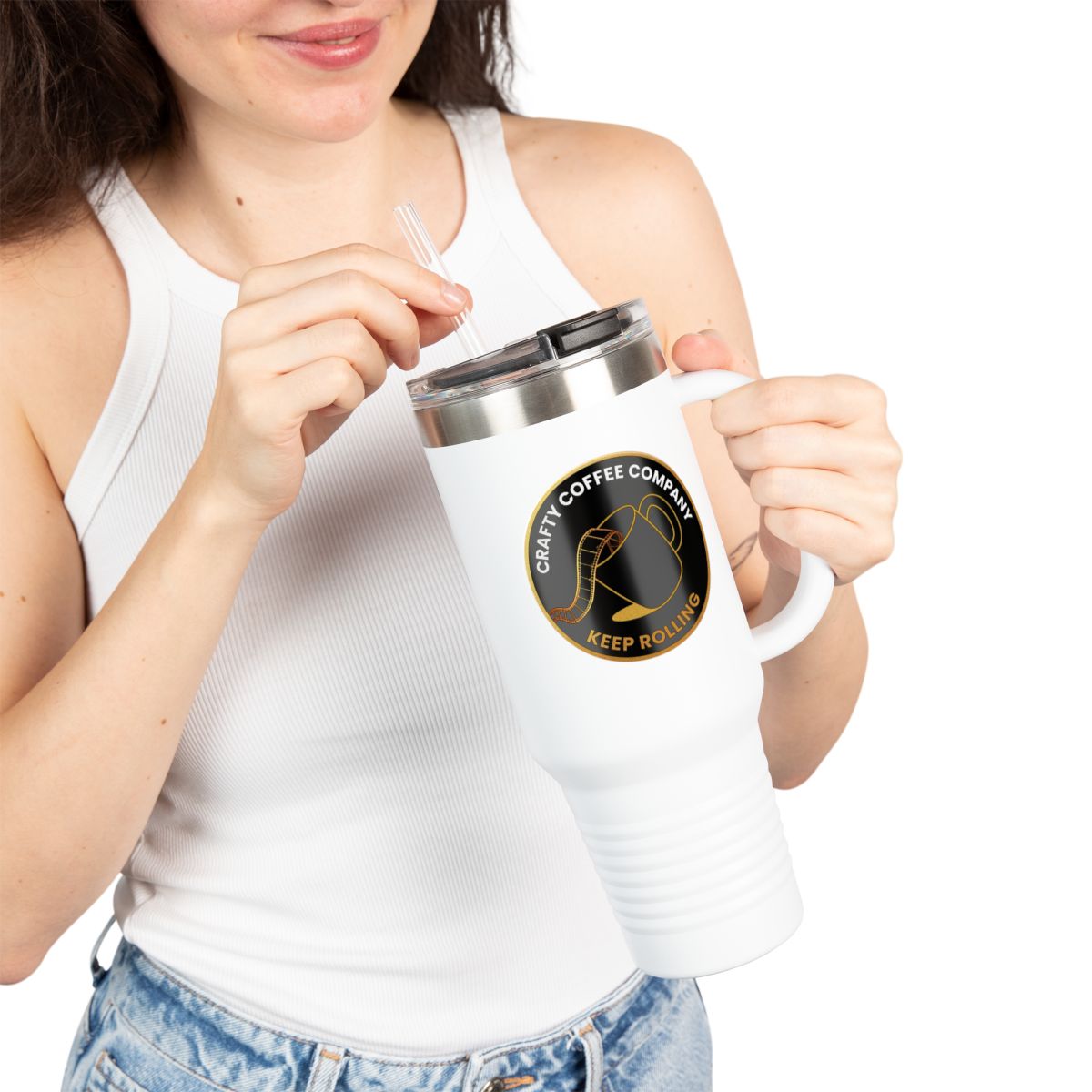 Female model holding a white mug with a Crafty Coffee Company logo on a white background